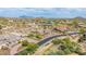 Aerial view of the home featuring desert landscaping, nearby houses and a mountain view in the background at 2255 N Hillridge --, Mesa, AZ 85207