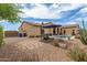 Backyard featuring a lounge area and pool with beautiful desert landscaping, perfect for relaxation and outdoor enjoyment at 2255 N Hillridge --, Mesa, AZ 85207
