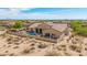 This backyard features a sparkling pool, covered patio and a desert landscaped fenced yard at 2255 N Hillridge --, Mesa, AZ 85207