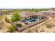 This backyard features a sparkling pool, covered patio and a desert landscaped fenced yard at 2255 N Hillridge --, Mesa, AZ 85207