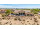 This backyard features a sparkling pool, covered patio and a desert landscaped fenced yard at 2255 N Hillridge --, Mesa, AZ 85207