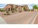 A long paver driveway leads to this home's front entrance and three-car garage at 2255 N Hillridge --, Mesa, AZ 85207