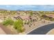 Beautiful single story home featuring desert landscaping, a tile roof and stone exterior accents at 2255 N Hillridge --, Mesa, AZ 85207