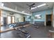 The modern gym is equipped with dumbbells, benches, and mirrors, providing a complete workout experience at 2255 N Hillridge --, Mesa, AZ 85207