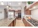 Bright, open kitchen with granite counters, stainless appliances, and ample counter space at 2255 N Hillridge --, Mesa, AZ 85207