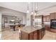 Gourmet kitchen featuring granite countertops, stainless steel appliances, and an open layout to living room at 2255 N Hillridge --, Mesa, AZ 85207