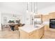 Spacious kitchen with a large island, stainless steel appliances, and open layout to the dining and living areas at 2255 N Hillridge --, Mesa, AZ 85207