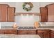 Close up on the kitchen featuring granite countertops, a cooktop, and custom cabinetry at 2255 N Hillridge --, Mesa, AZ 85207