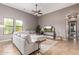 Comfortable living room featuring a large sectional sofa, ceiling fan, and plenty of natural light at 2255 N Hillridge --, Mesa, AZ 85207