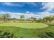 Well-maintained putting green offers a perfect spot for golf enthusiasts to practice and enjoy the outdoors at 2255 N Hillridge --, Mesa, AZ 85207