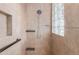 Tiled walk-in shower with glass blocks and a shower head with mounted shelves at 2255 N Hillridge --, Mesa, AZ 85207