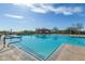 A large swimming pool with a pavilion and lounge chairs offers a luxurious and relaxing outdoor experience at 2255 N Hillridge --, Mesa, AZ 85207