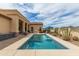 Stunning swimming pool with spa and BBQ, framed by lush desert landscaping and a covered patio for outdoor entertainment at 2255 N Hillridge --, Mesa, AZ 85207