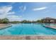 This large swimming pool features clear blue water and plenty of space for swimming, all under a sunny sky at 2255 N Hillridge --, Mesa, AZ 85207