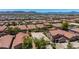 Aerial view of a desert community with mountain views at 2421 W Romley Rd, Phoenix, AZ 85041