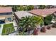 Aerial view of single-Gathering home with tile roof and lush landscaping at 2421 W Romley Rd, Phoenix, AZ 85041