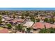 Aerial view of a desert community with mountain views and turf at 2421 W Romley Rd, Phoenix, AZ 85041