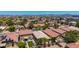 Aerial view of a desert community with mountain views and turf at 2421 W Romley Rd, Phoenix, AZ 85041