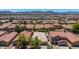 Aerial view of a desert community with mountain views at 2421 W Romley Rd, Phoenix, AZ 85041