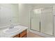 Clean bathroom with glass door shower, vanity and mirror at 2421 W Romley Rd, Phoenix, AZ 85041