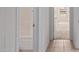 Clean bathroom featuring tiled floors, a shower/bath, and a hallway view at 2421 W Romley Rd, Phoenix, AZ 85041