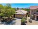 Aerial view of home with two car garage, desert landscaping and tile roof at 2421 W Romley Rd, Phoenix, AZ 85041