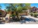 Exterior shot of single Gathering home with well-kept desert landscaping and tile roof at 2421 W Romley Rd, Phoenix, AZ 85041