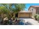 Charming single-Gathering home features desert landscaping, tile roof and two-car garage at 2421 W Romley Rd, Phoenix, AZ 85041
