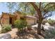 Welcoming single-story home featuring low maintenance desert landscaping, tile roof, and an attached two-car garage at 2421 W Romley Rd, Phoenix, AZ 85041