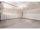 Unfinished garage with drywall, lighting, and garage door at 2421 W Romley Rd, Phoenix, AZ 85041