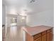 Open living room with tile floors, sliding door, and views of the backyard at 2421 W Romley Rd, Phoenix, AZ 85041