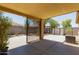 View of the covered patio, a shed, and an AC unit in the backyard at 2421 W Romley Rd, Phoenix, AZ 85041