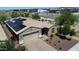 A charming single-story home with solar panels, a two-car garage, desert landscaping, and a brick-paved driveway at 31324 N 26 Glen Gln, Phoenix, AZ 85085