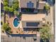 Overhead view of a home with a backyard pool and solar panels, highlighting its energy efficiency and outdoor living at 3373 W Five Mile Peak Dr, San Tan Valley, AZ 85144