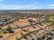 Bird's-eye view of a community near a park, featuring well-maintained streets and desert-friendly landscaping at 3373 W Five Mile Peak Dr, San Tan Valley, AZ 85144