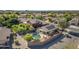 Aerial shot of property highlighting pool, outdoor living, solar panels, privacy fence, and landscaping in residential neighborhood at 3373 W Five Mile Peak Dr, San Tan Valley, AZ 85144
