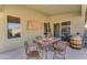 Covered back patio features a dining table with seating and outdoor furniture at 3373 W Five Mile Peak Dr, San Tan Valley, AZ 85144