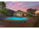 Private backyard featuring a refreshing swimming pool and desert landscaping at 3373 W Five Mile Peak Dr, San Tan Valley, AZ 85144