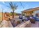 Backyard with covered back patio, outdoor furniture, pool, and desert landscaping at 3373 W Five Mile Peak Dr, San Tan Valley, AZ 85144