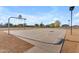 Outdoor basketball court with lighting for evening play, provides a recreational space for sports and activities within the community at 3373 W Five Mile Peak Dr, San Tan Valley, AZ 85144