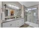 Well appointed bathroom features a double vanity, stylish fixtures, and a glass enclosed shower at 3373 W Five Mile Peak Dr, San Tan Valley, AZ 85144