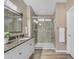 Well appointed bathroom featuring a walk-in shower, modern fixtures, and comfortable lighting at 3373 W Five Mile Peak Dr, San Tan Valley, AZ 85144