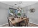 Dining area with large window and seating for four at 3373 W Five Mile Peak Dr, San Tan Valley, AZ 85144