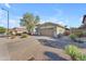 Charming single-story home featuring low-maintenance desert landscaping and a two-car garage at 3373 W Five Mile Peak Dr, San Tan Valley, AZ 85144