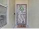 Inviting front entrance features a decorative security door and 'hello' welcome mat at 3373 W Five Mile Peak Dr, San Tan Valley, AZ 85144