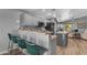 Stylish kitchen with barstool seating, open to the living room for seamless interaction at 3373 W Five Mile Peak Dr, San Tan Valley, AZ 85144