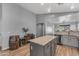 Kitchen featuring a central island with stone countertops and modern gray cabinetry at 3373 W Five Mile Peak Dr, San Tan Valley, AZ 85144