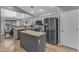 Modern kitchen features stainless steel appliances, granite countertops, and an island at 3373 W Five Mile Peak Dr, San Tan Valley, AZ 85144