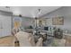 Bright living room with ample seating, stylish decor, and a ceiling fan at 3373 W Five Mile Peak Dr, San Tan Valley, AZ 85144