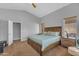 Bright main bedroom featuring a ceiling fan, comfortable bed, and a carpeted floor at 3373 W Five Mile Peak Dr, San Tan Valley, AZ 85144